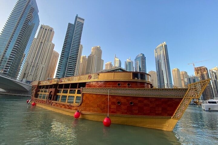 Experience Dubai's skyline from the luxurious Ocean Empress Dhow where modern comforts meet traditional craftsmanship on a grand vessel making every moment unforgettable.